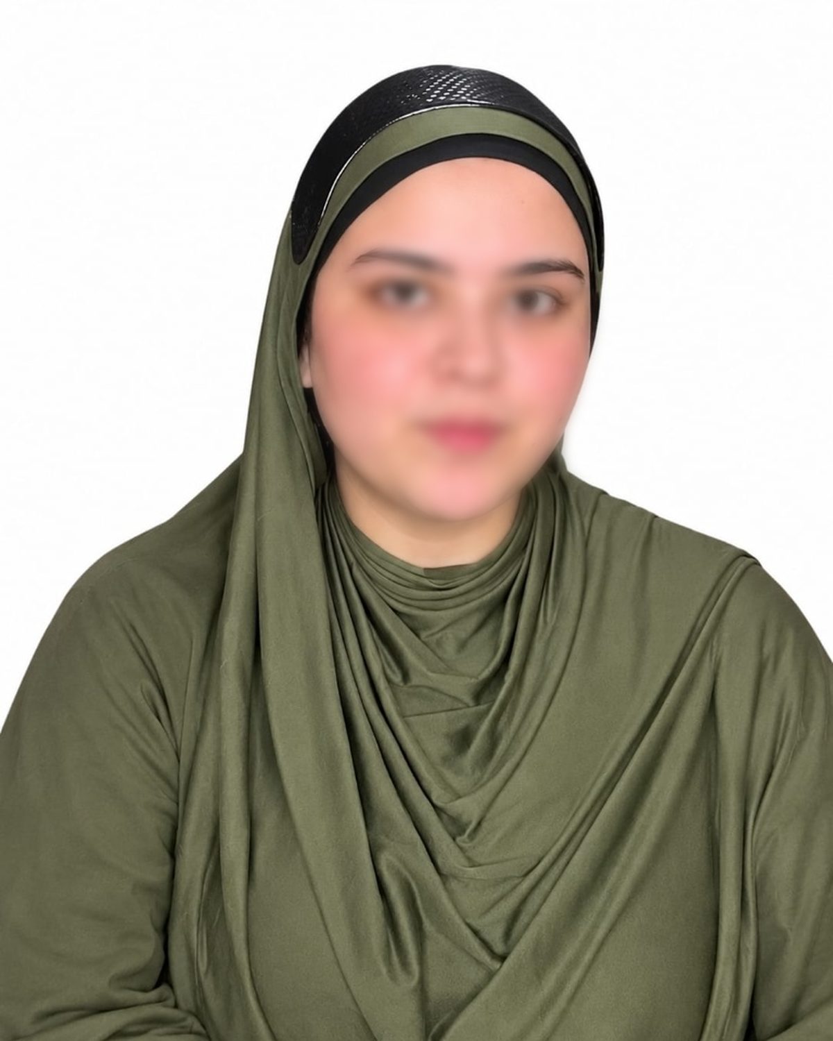 Woman wearing the Hijab Grip under an olive hijab